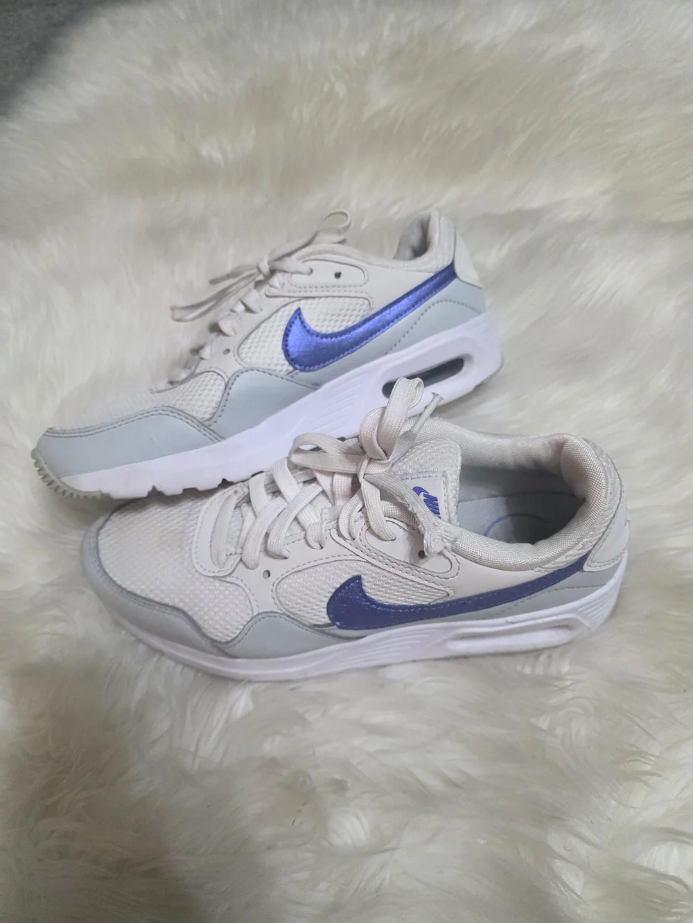 Nike Women’s Cream Sneakers with Metallic Blue Swoosh